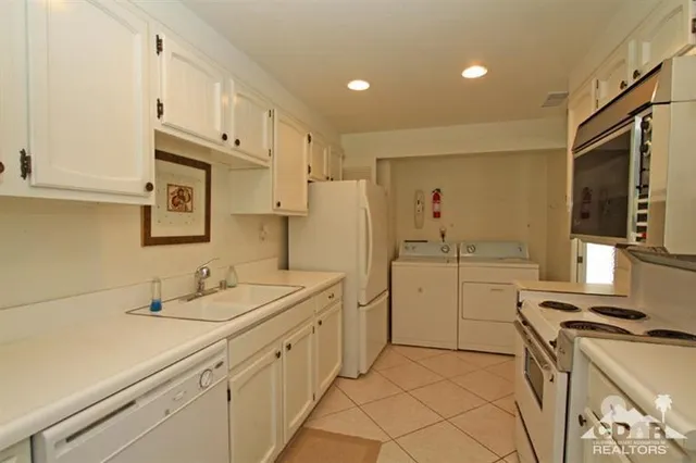 a bedroom with a bed and a lamp