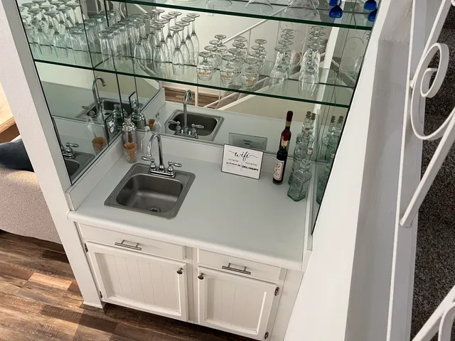 a spacious bedroom with a bed and a window