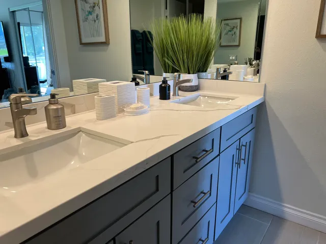 a view of a patio with table and chairs under an umbrella