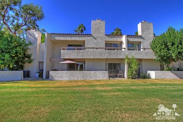a view of swimming pool with an outdoor space and seating area