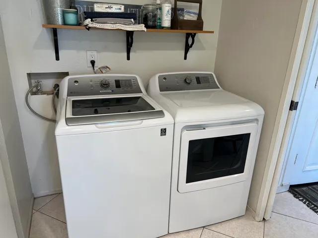 a kitchen with a sink appliances and cabinets
