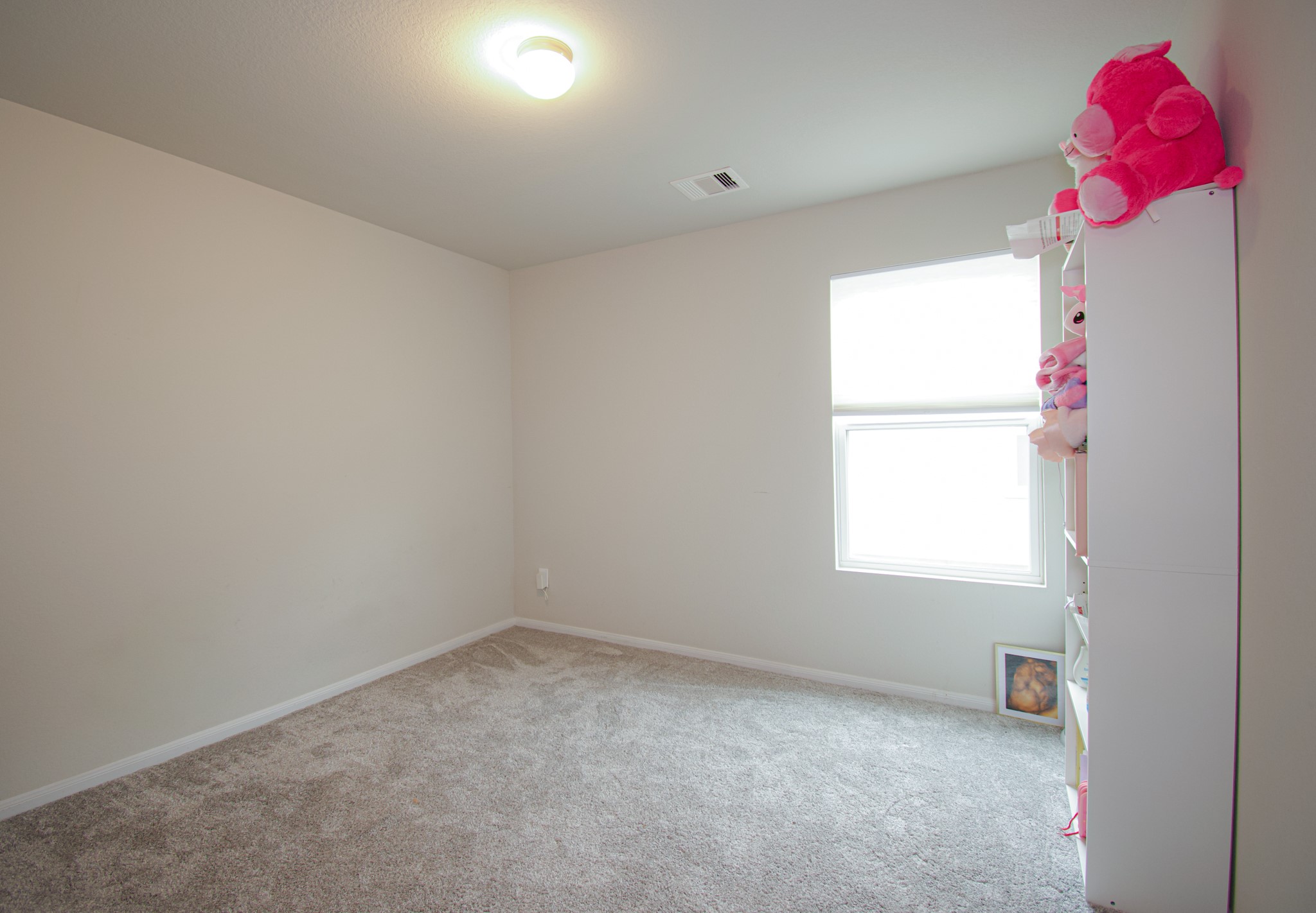 2642 Ridgeback Drive Rosenberg, TX 77471 - Photo 11 of 13 an empty room with a window