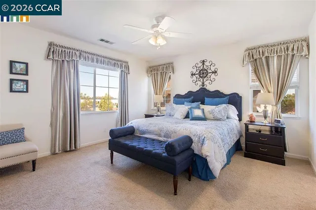 a bedroom with a bed and a couch