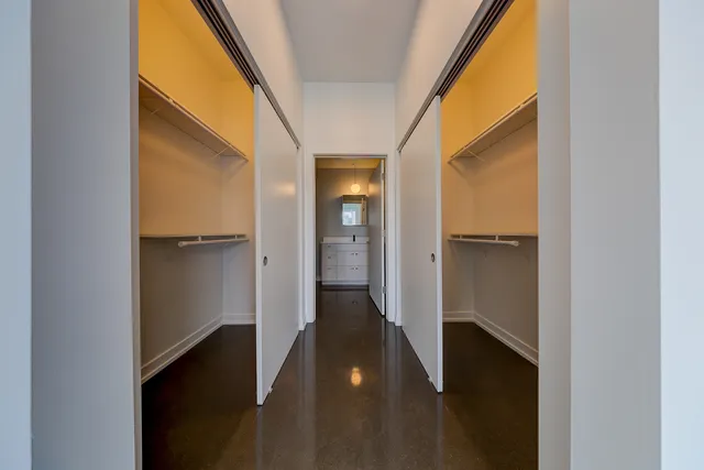 a view of hallway with wooden floor