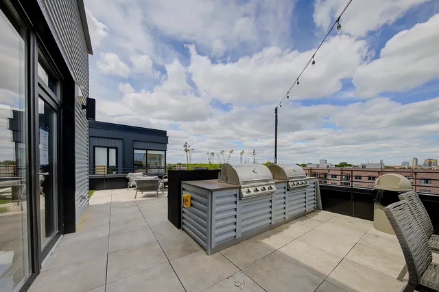 a view of a terrace with couches chairs