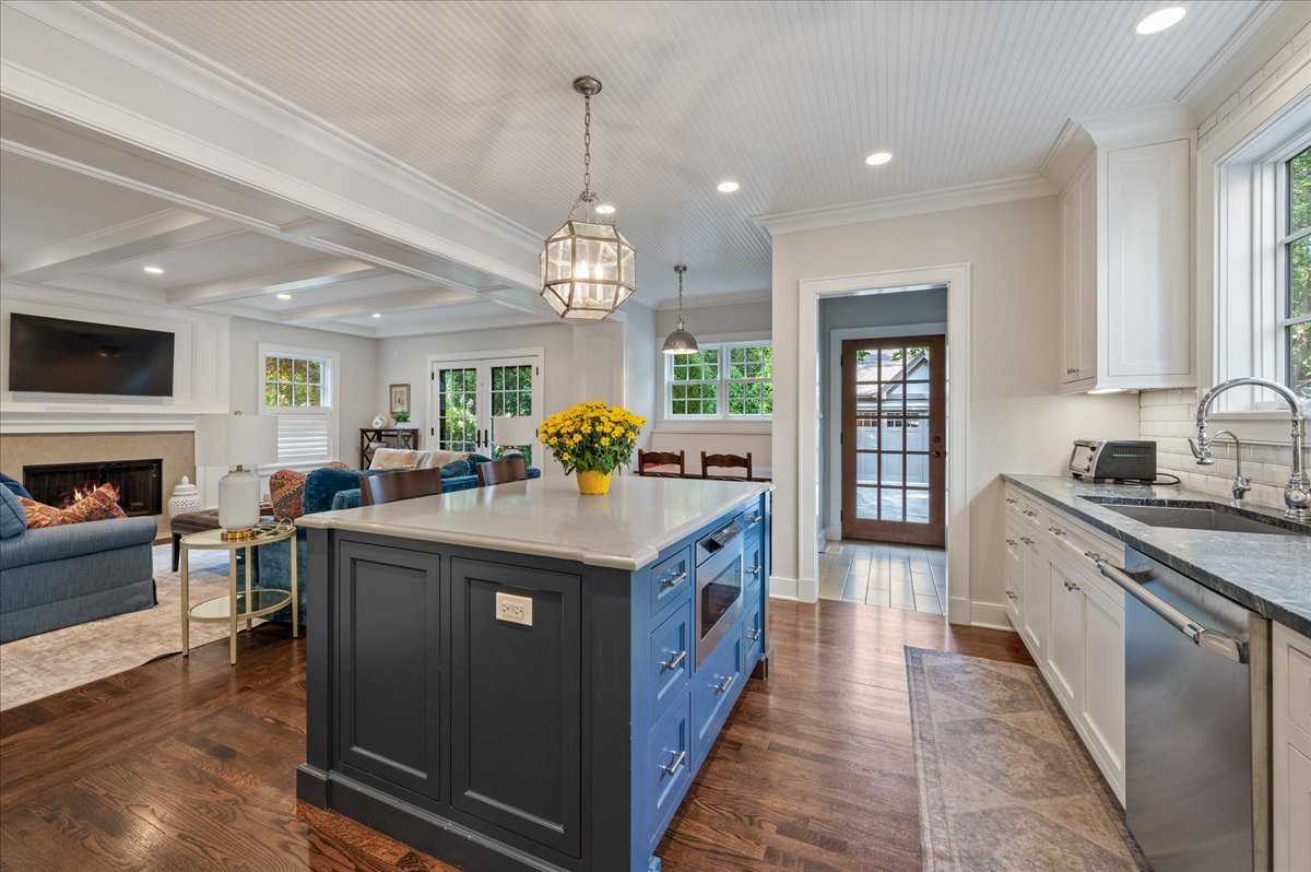 1503 Edgewood Lane Winnetka, IL 60093 - Photo 12 of 46 a kitchen with kitchen island granite countertop a stove and a wooden floors