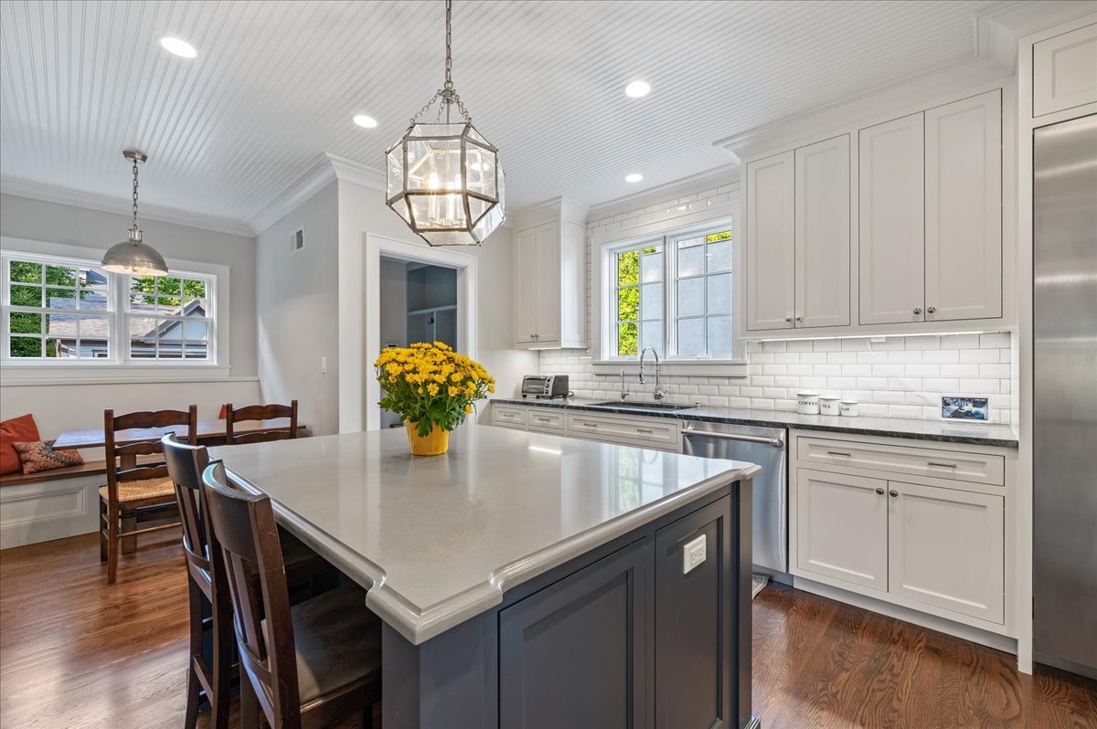 1503 Edgewood Lane Winnetka, IL 60093 - Photo 13 of 46 a kitchen with a center island and cabinets