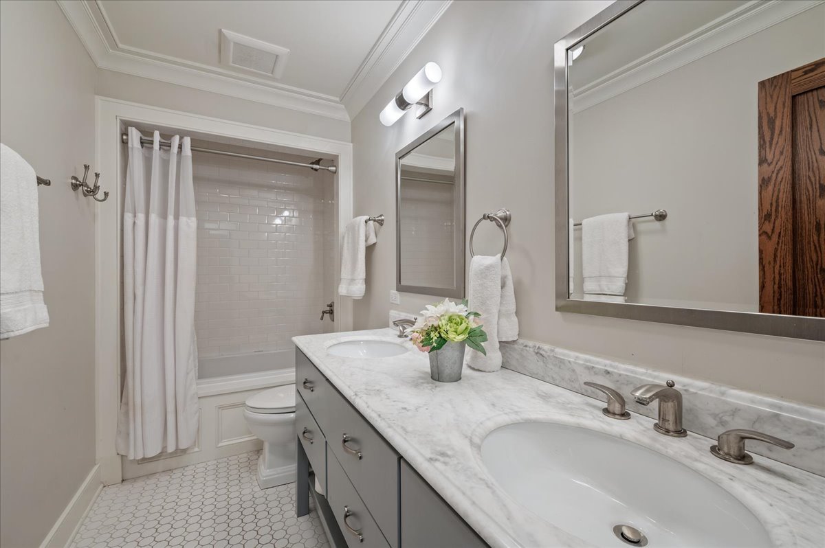 1503 Edgewood Lane Winnetka, IL 60093 - Photo 31 of 46 a bathroom with a granite countertop sink a toilet and a large mirror