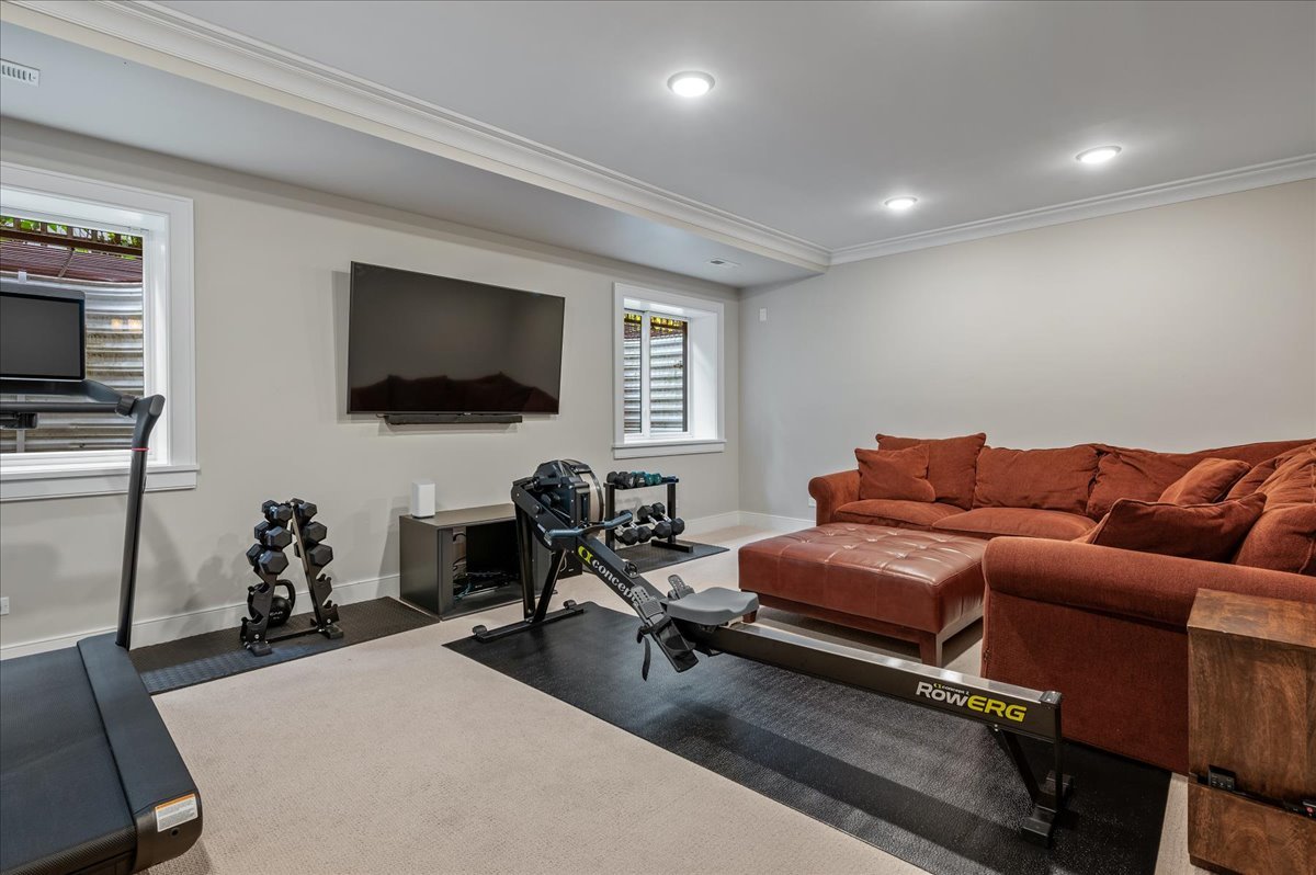 1503 Edgewood Lane Winnetka, IL 60093 - Photo 33 of 46 a living room with furniture a flat screen tv and kitchen view
