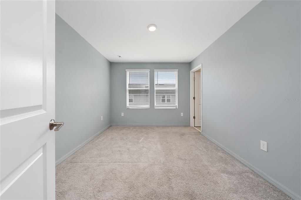 2060 Viewfinder Street Kissimmee, FL 34758 - Photo 12 of 23 an empty room with windows