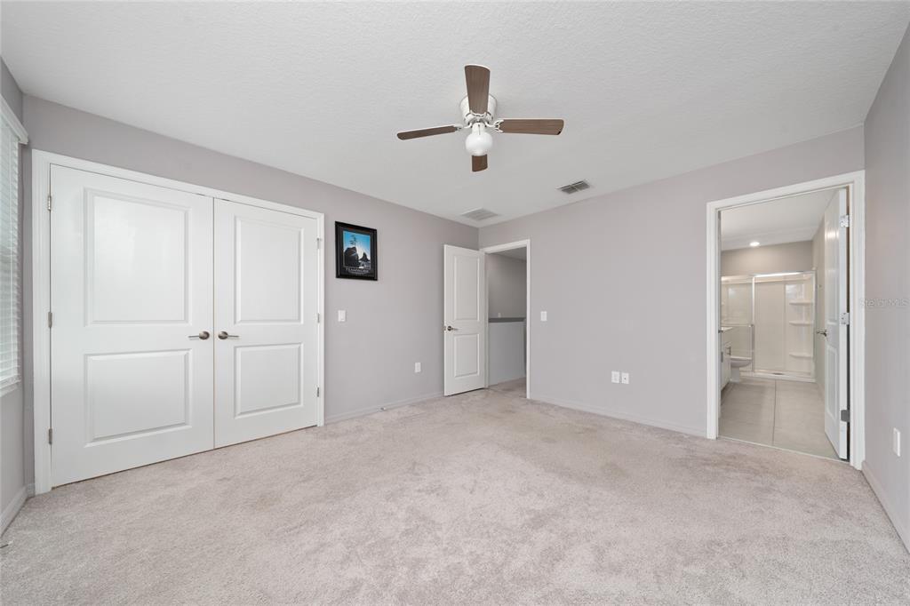 2060 Viewfinder Street Kissimmee, FL 34758 - Photo 16 of 23 a view of an empty room and a ceiling fan