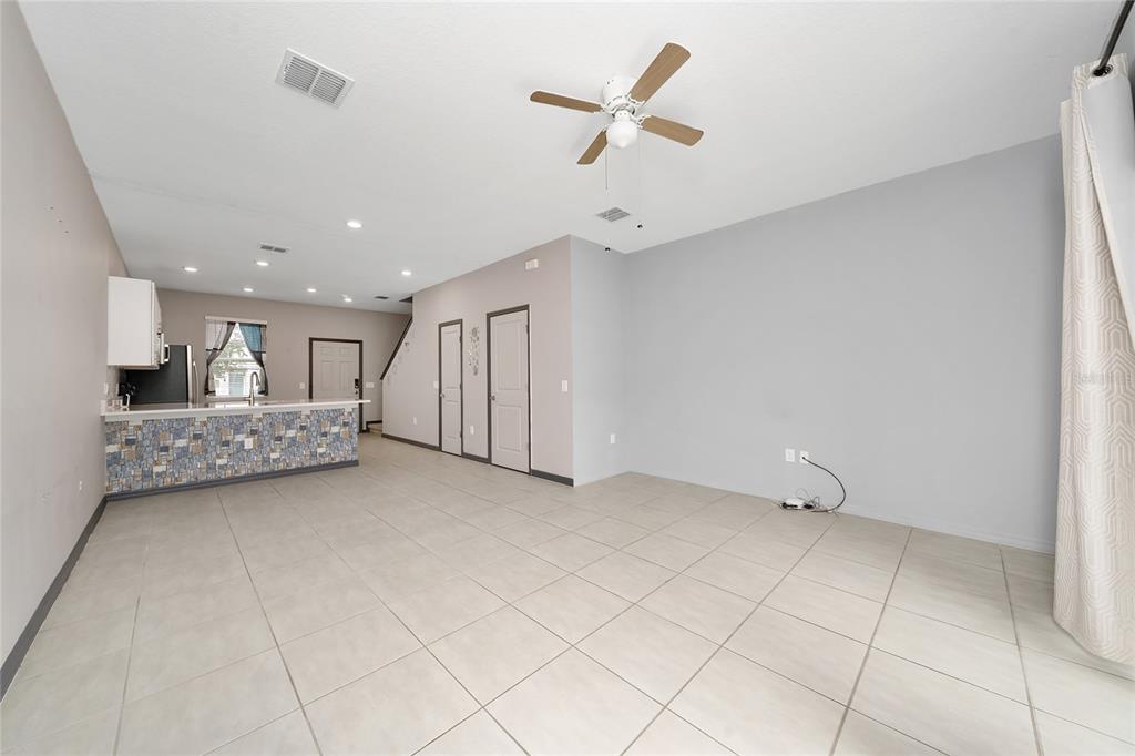 2060 Viewfinder Street Kissimmee, FL 34758 - Photo 5 of 23 a view of a livingroom with a ceiling fan and window