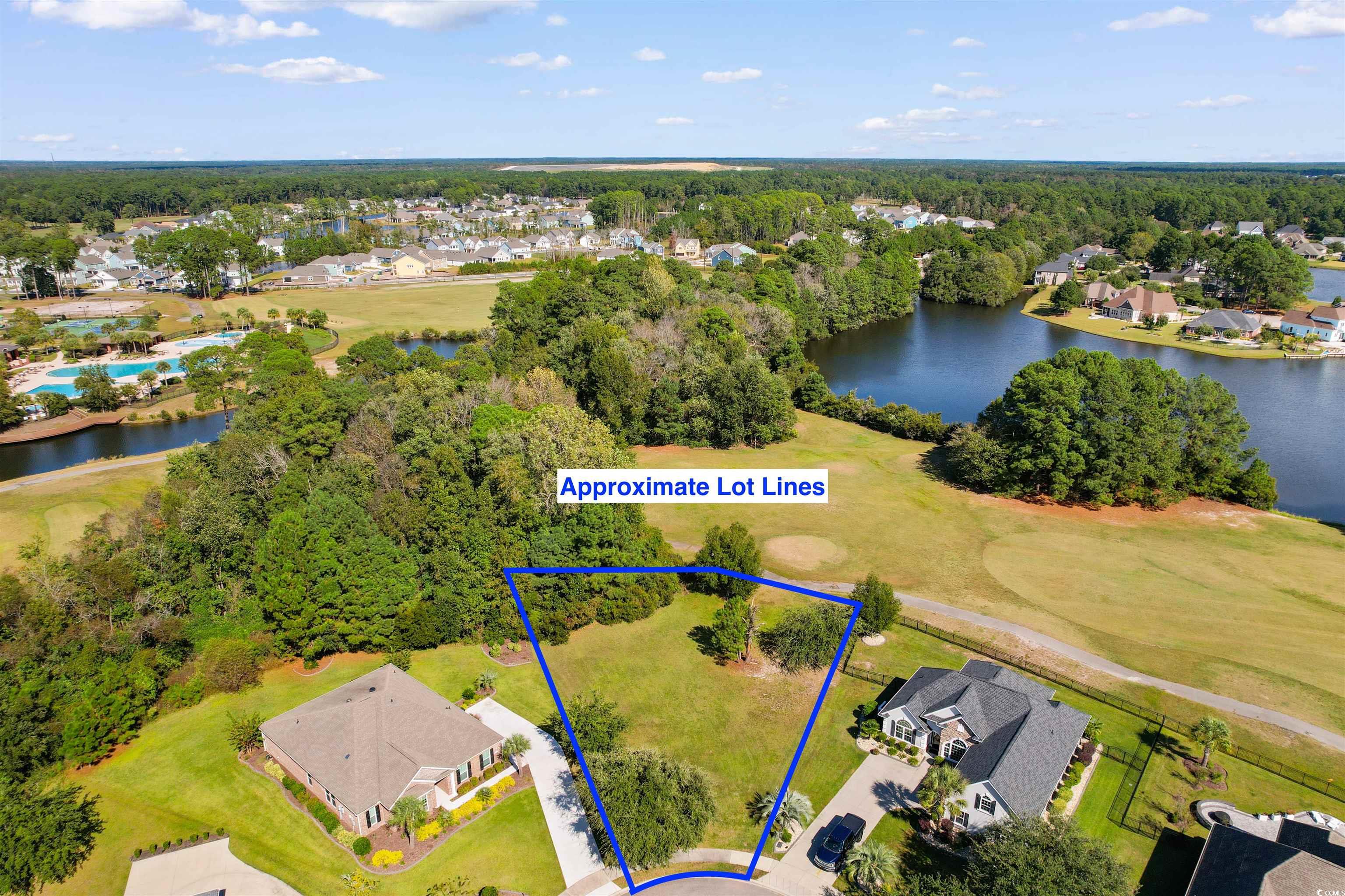 1005 Whooping Crane Drive Conway, SC 29526 - Photo 11 of 35 Aerial view of residential area featuring a nearby body of water, property boundaries highlighted, and a golf club