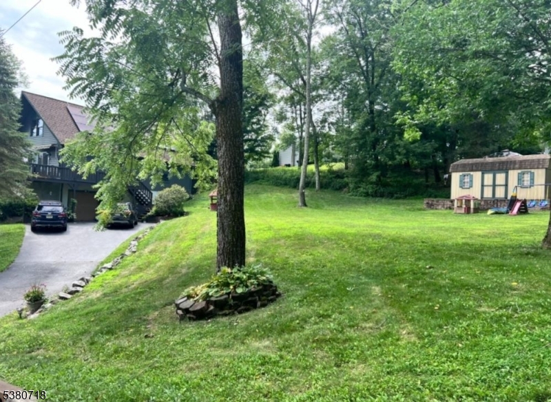12 Ravine Road Wantage, NJ 07461 - Photo 19 of 19 a view of a house with a backyard and a tree