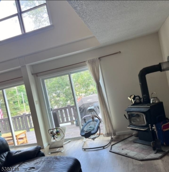 12 Ravine Road Wantage, NJ 07461 - Photo 6 of 19 a room with gym equipment and a large window