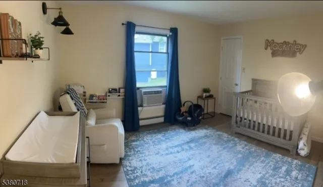 a bedroom with a bed and a fireplace