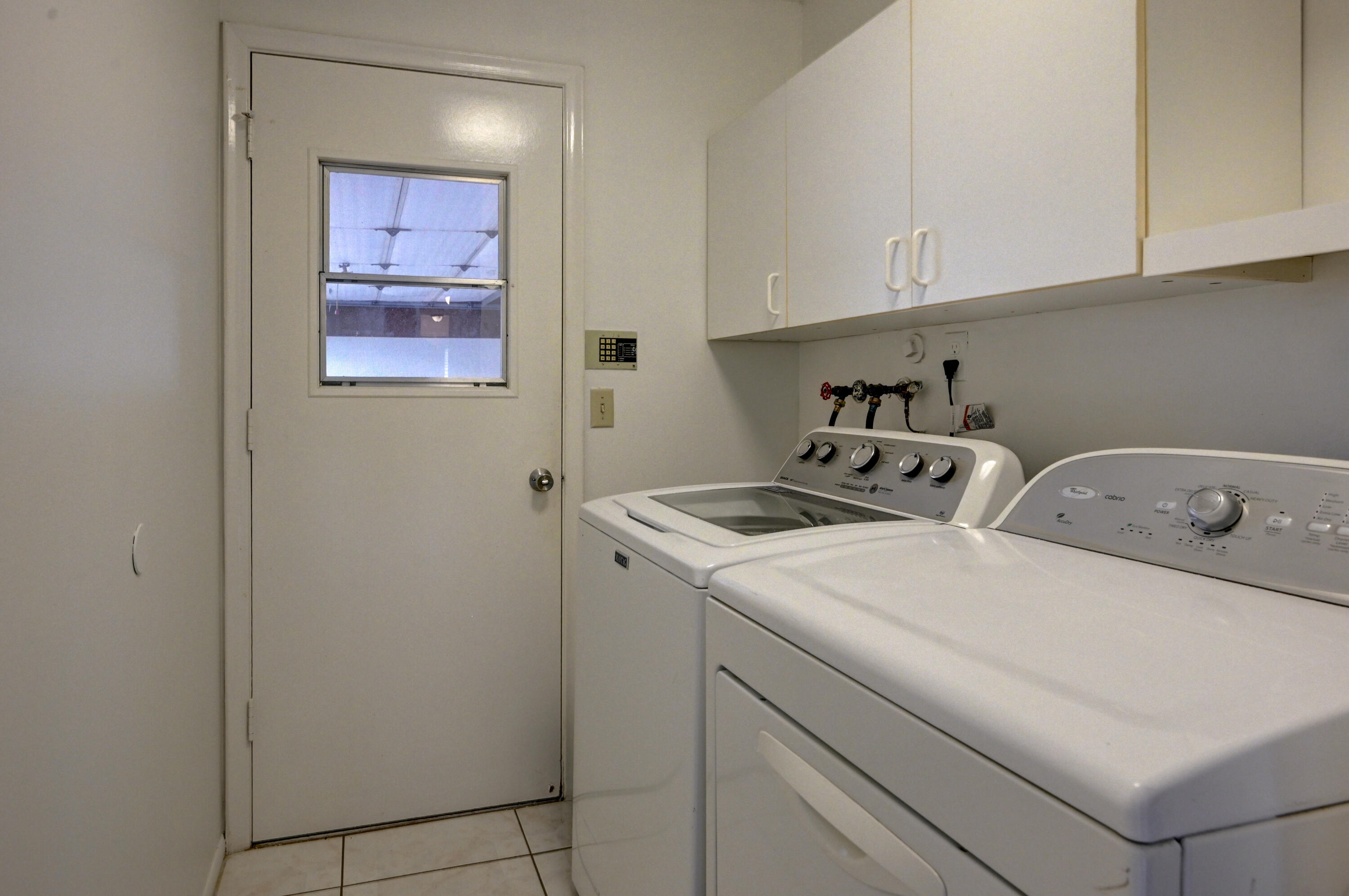 23328 Southwest 58th Avenue, Unit C Boca Raton, FL 33428 - Photo 13 of 35 a utility room with dryer and washer