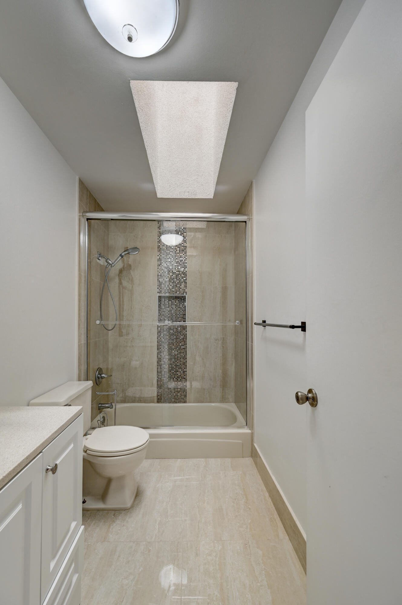 23328 Southwest 58th Avenue, Unit C Boca Raton, FL 33428 - Photo 18 of 35 a bathroom with a granite countertop sink toilet and shower