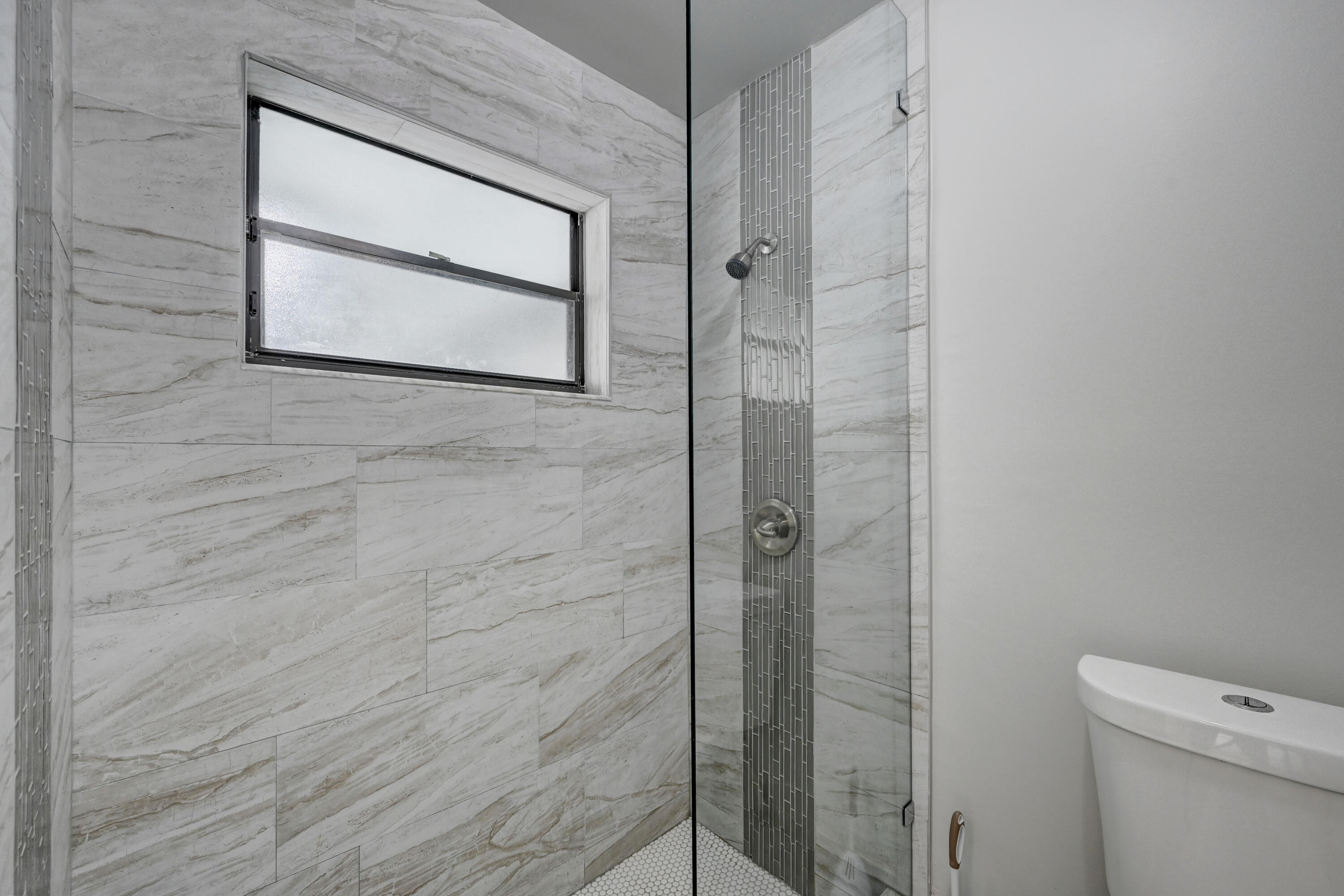23328 Southwest 58th Avenue, Unit C Boca Raton, FL 33428 - Photo 26 of 35 a bathroom with a shower and toilet