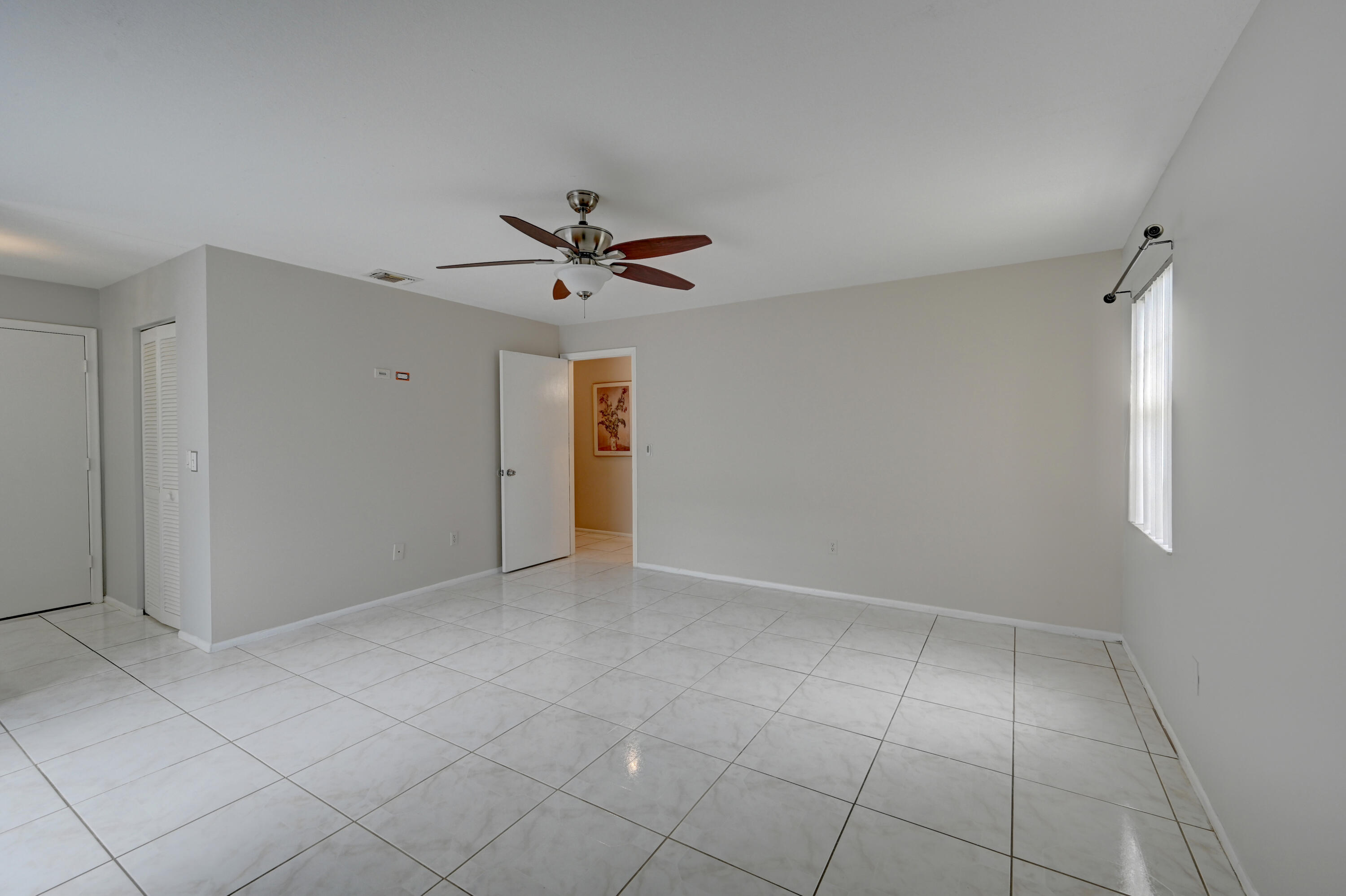 23328 Southwest 58th Avenue, Unit C Boca Raton, FL 33428 - Photo 27 of 35 wooden floor in an empty room