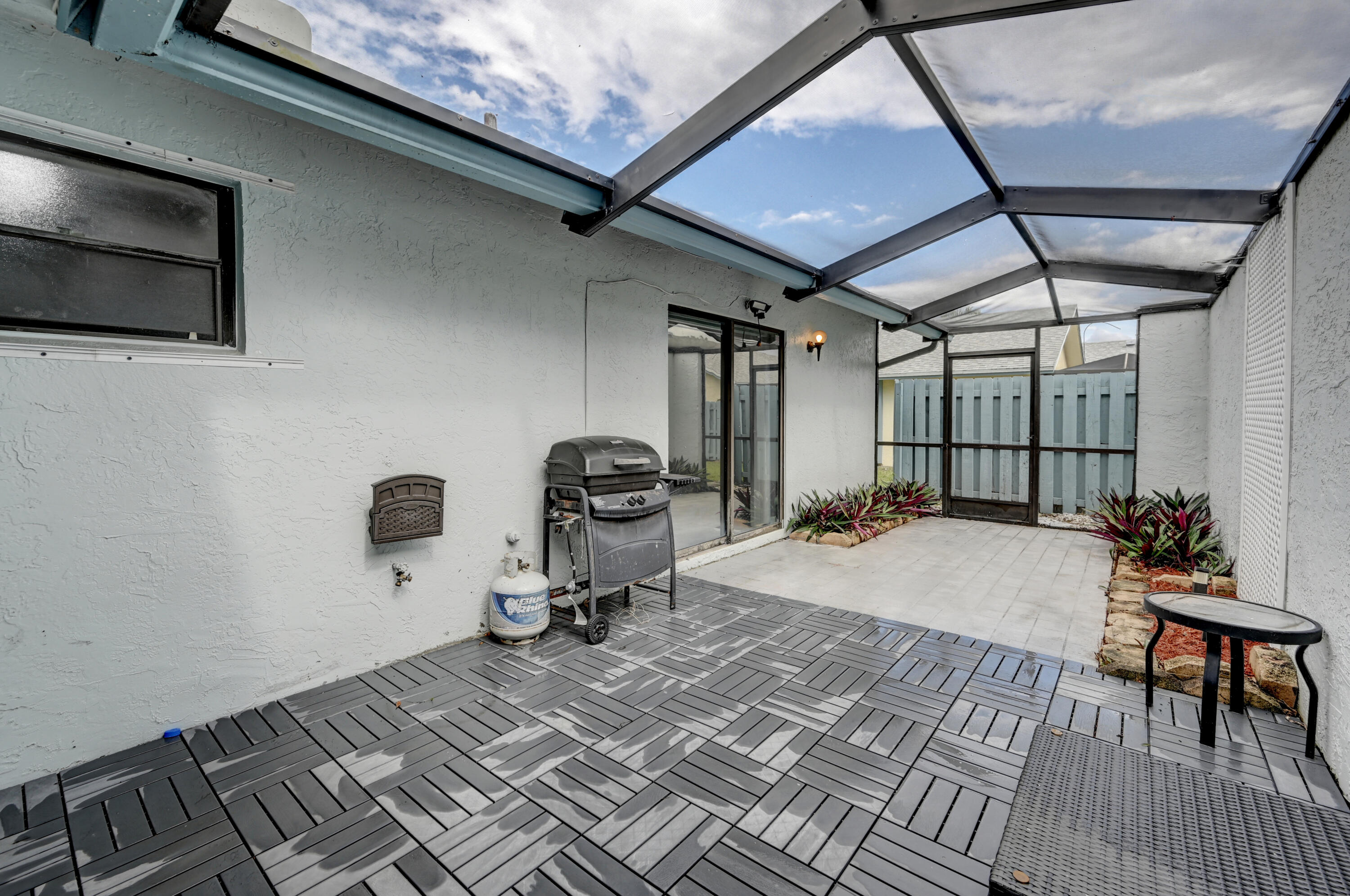 23328 Southwest 58th Avenue, Unit C Boca Raton, FL 33428 - Photo 30 of 35 a room with gym equipment and a rug