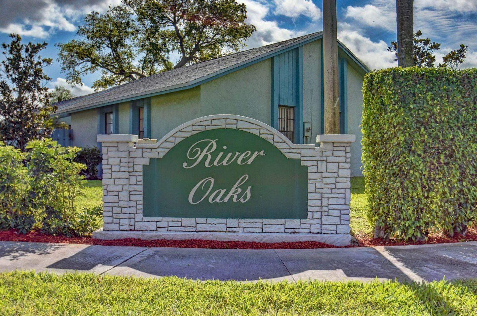 23328 Southwest 58th Avenue, Unit C Boca Raton, FL 33428 - Photo 3 of 35 a sign on the side of a building