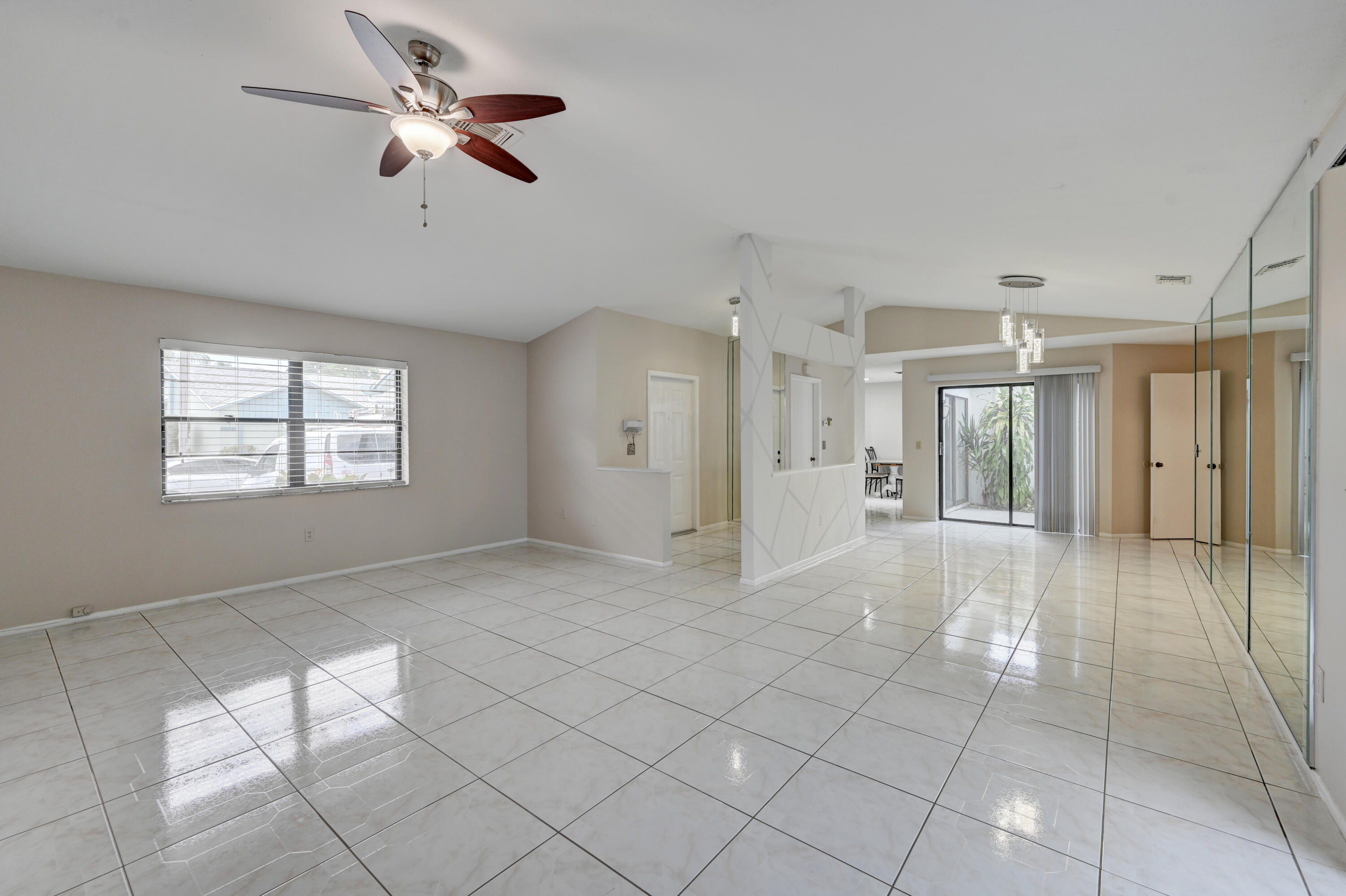 23328 Southwest 58th Avenue, Unit C Boca Raton, FL 33428 - Photo 4 of 35 a view of an empty room with a window