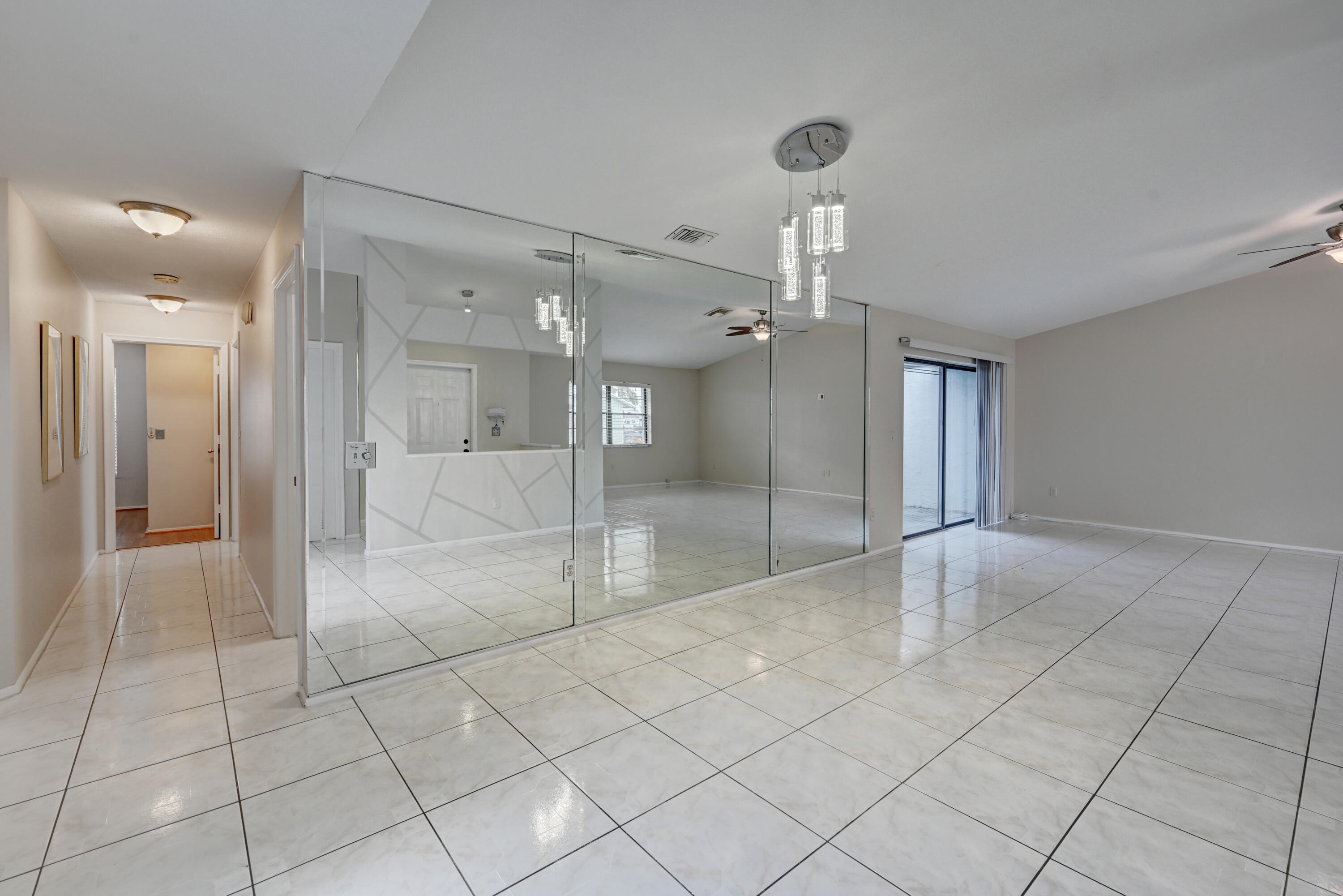 23328 Southwest 58th Avenue, Unit C Boca Raton, FL 33428 - Photo 6 of 35 a view of an empty room and a bathroom