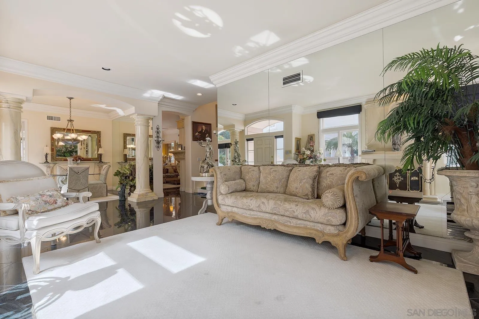 5448 Renaissance Avenue San Diego, CA 92122 - Photo 13 of 35 a living room with furniture and a potted plant
