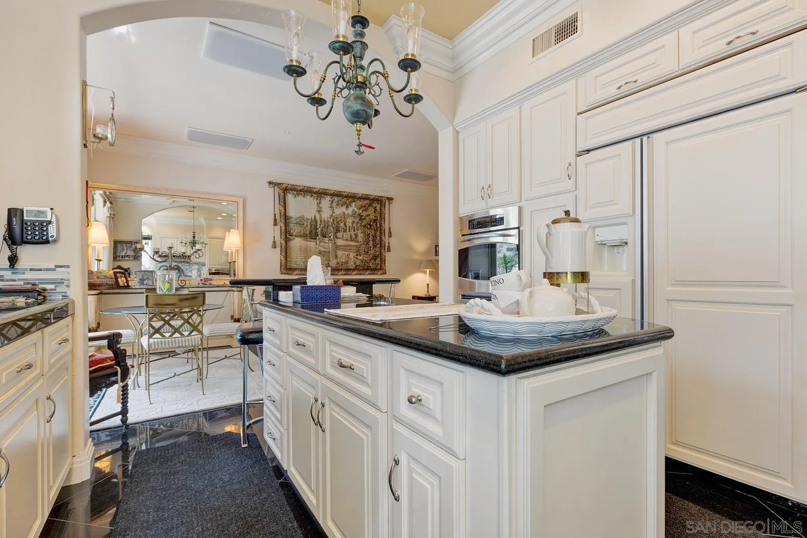 5448 Renaissance Avenue San Diego, CA 92122 - Photo 15 of 35 a kitchen with cabinets a sink and appliances