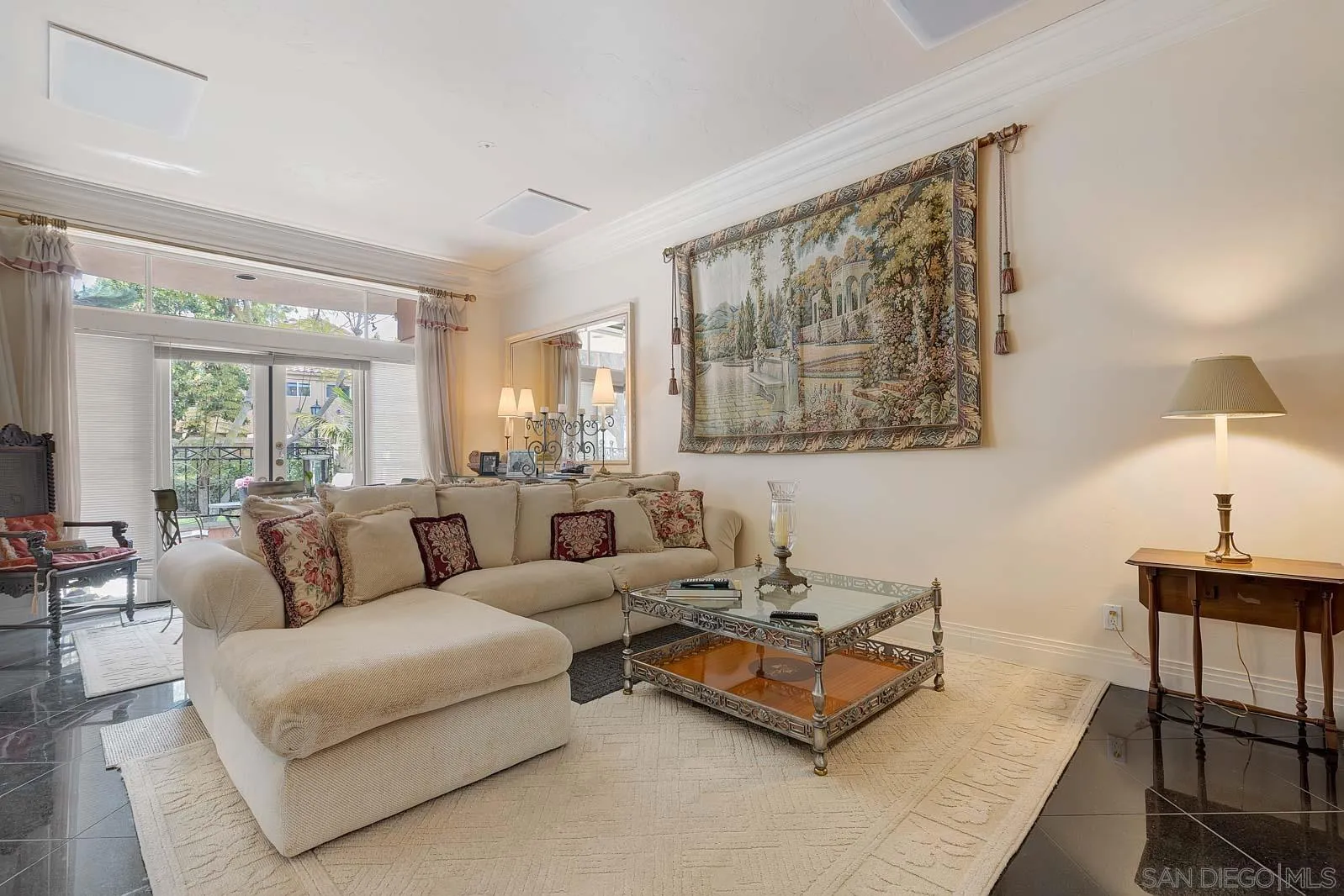 5448 Renaissance Avenue San Diego, CA 92122 - Photo 17 of 35 a living room with furniture and a large window