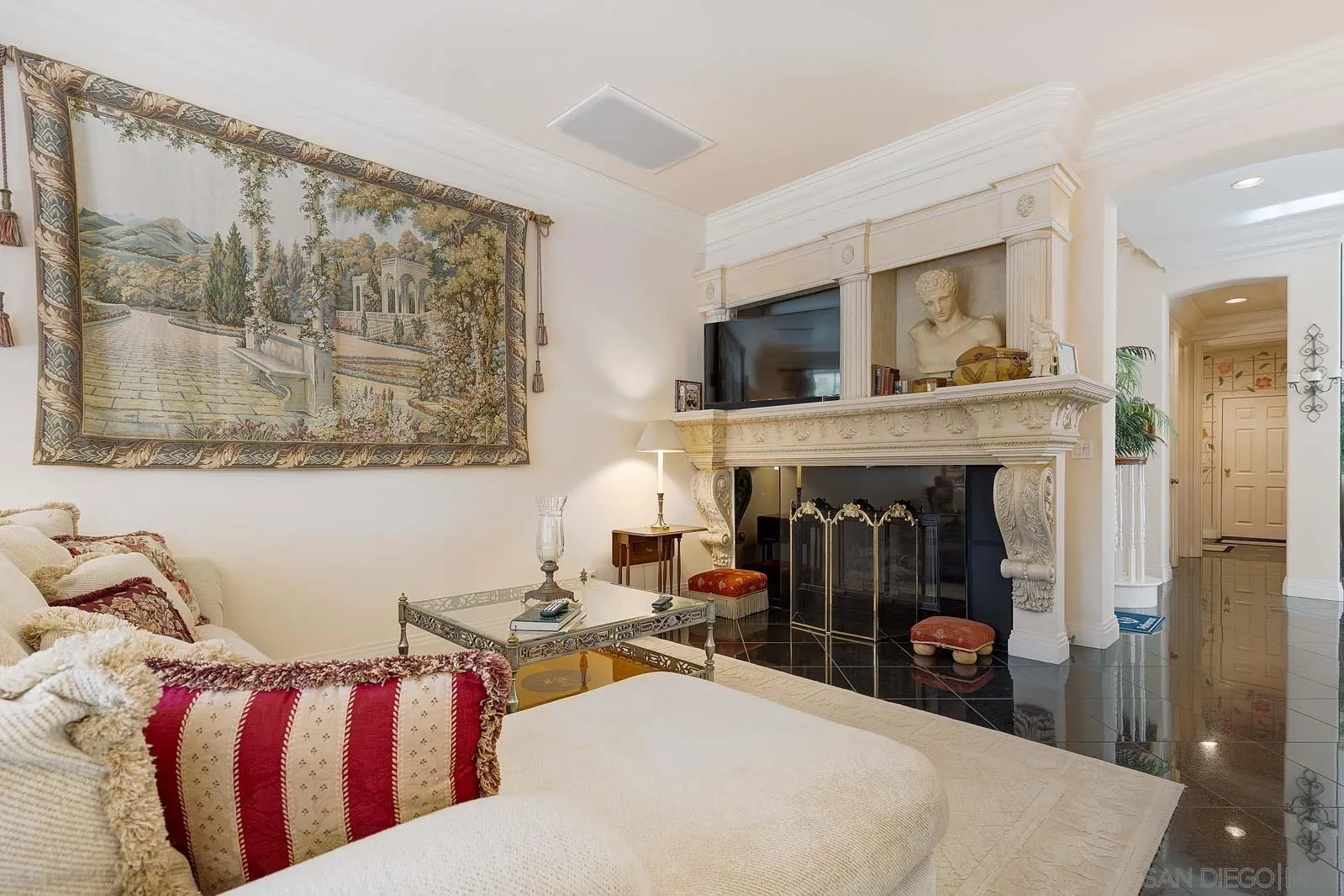 5448 Renaissance Avenue San Diego, CA 92122 - Photo 20 of 35 a living room with furniture and a fireplace