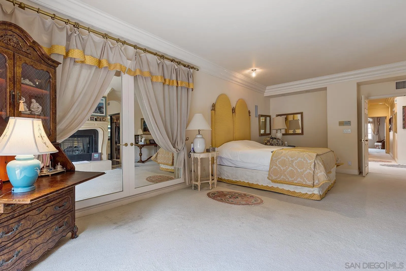 5448 Renaissance Avenue San Diego, CA 92122 - Photo 21 of 35 a spacious bedroom with a bed and a large window