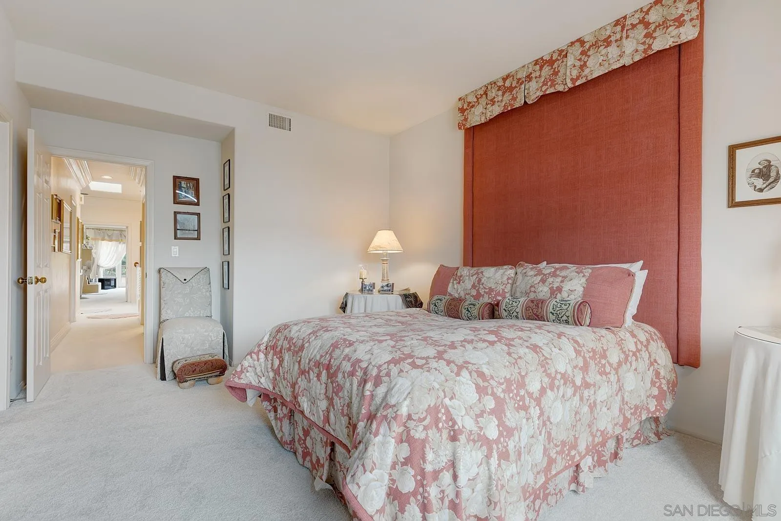 5448 Renaissance Avenue San Diego, CA 92122 - Photo 24 of 35 a bedroom with a bed and a refrigerator