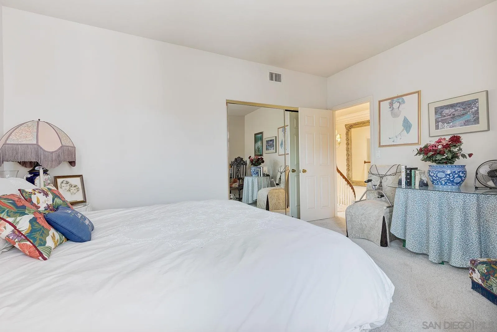 5448 Renaissance Avenue San Diego, CA 92122 - Photo 26 of 35 a bedroom with a bed and a dresser