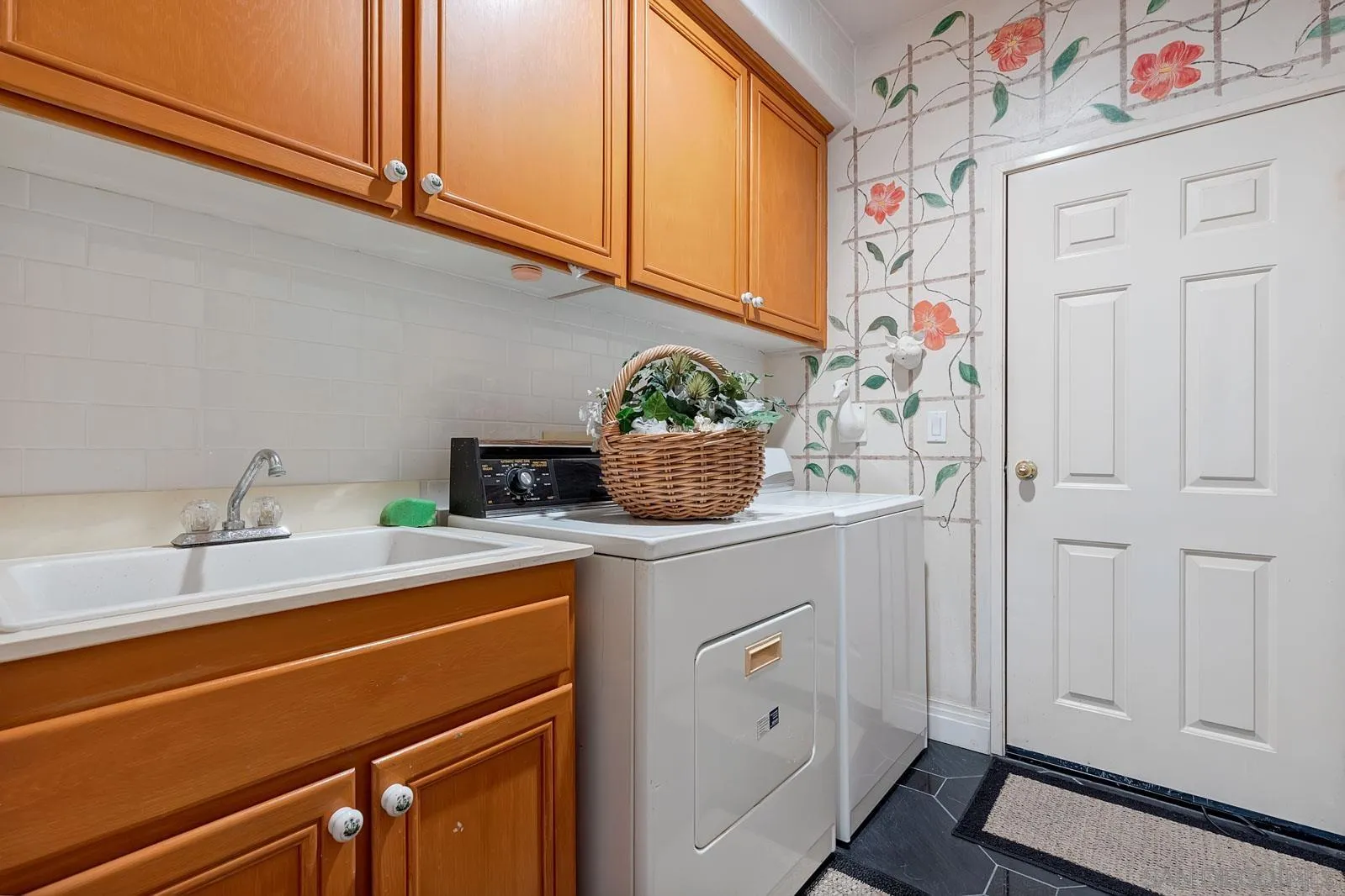 5448 Renaissance Avenue San Diego, CA 92122 - Photo 30 of 35 a kitchen with a sink and cabinets