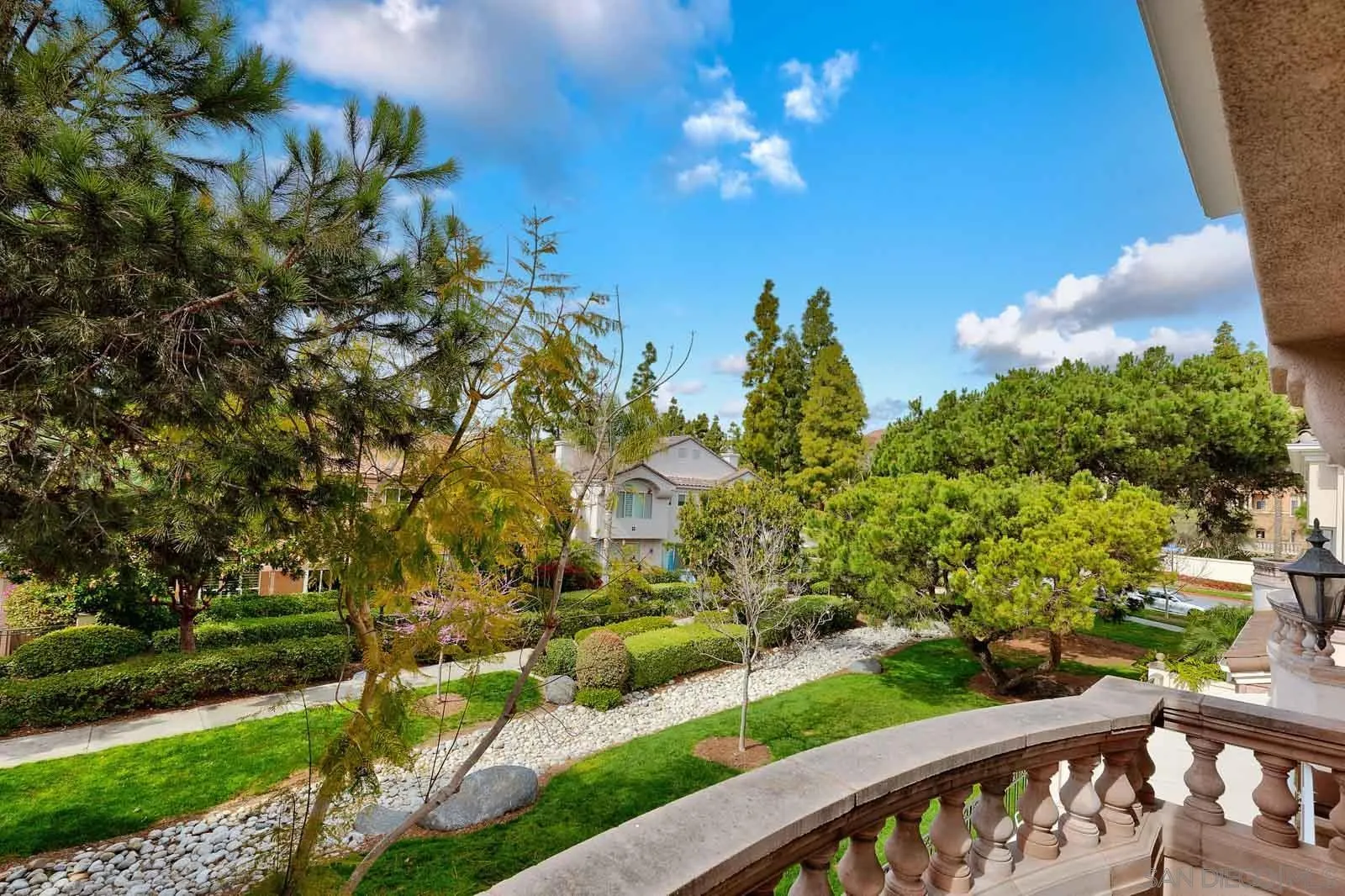 5448 Renaissance Avenue San Diego, CA 92122 - Photo 3 of 35 a view of a swimming pool with an outdoor seating