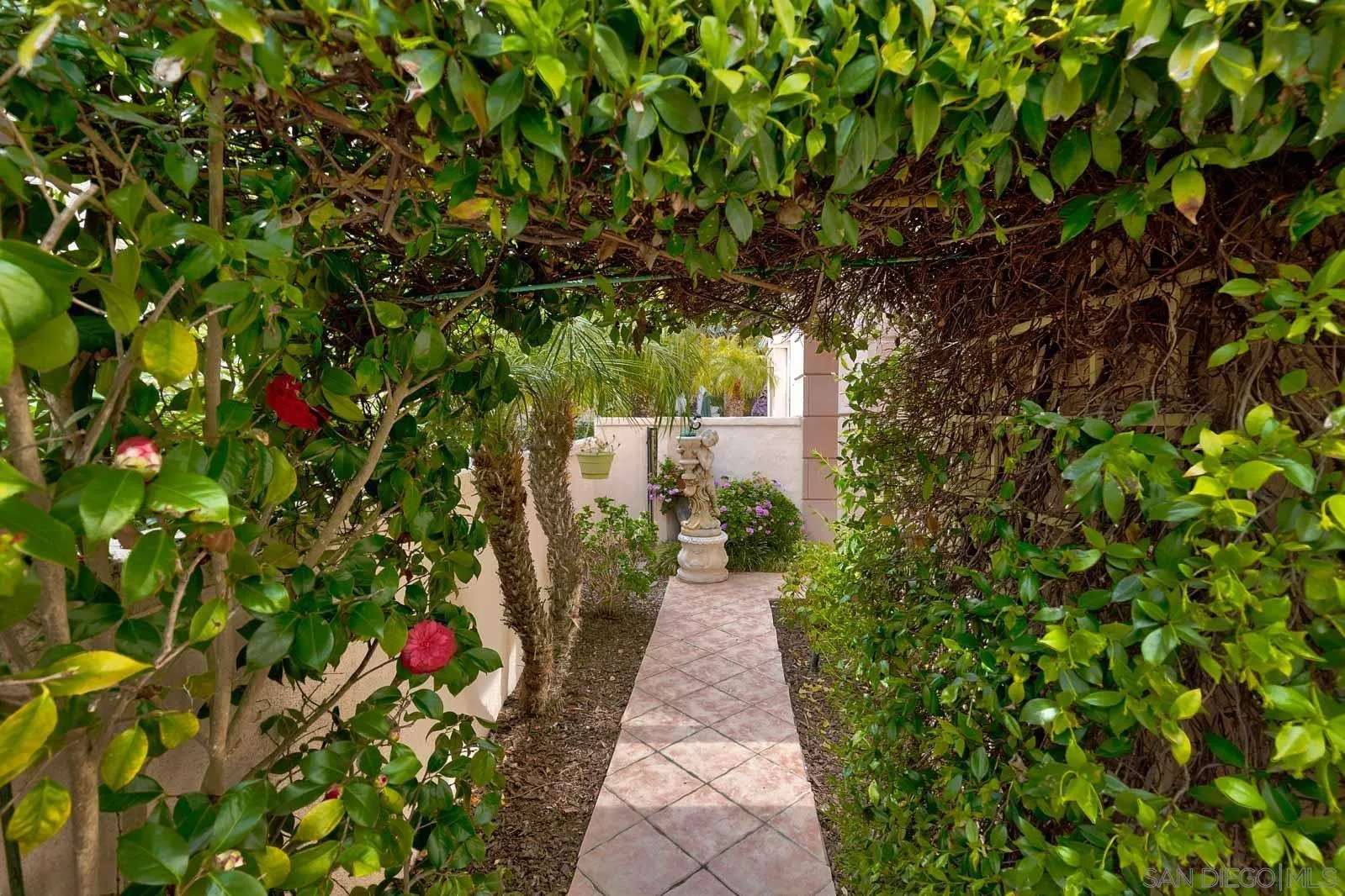 5448 Renaissance Avenue San Diego, CA 92122 - Photo 5 of 35 a backyard of a house with lots of green space