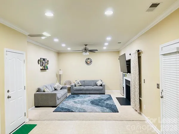 a living room with furniture and a rug