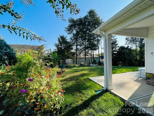 a view of a garden with a patio