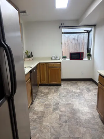 a bathroom with a tub sink and mirror