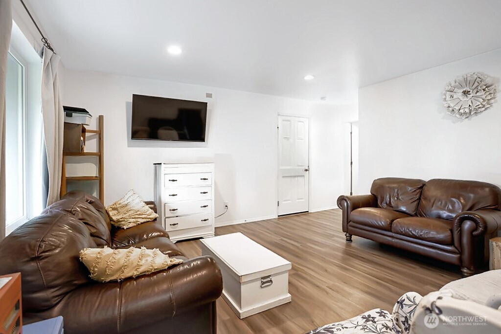105 Johnson Road South Winlock, WA 98596 - Photo 14 of 32 a living room with furniture and a flat screen tv