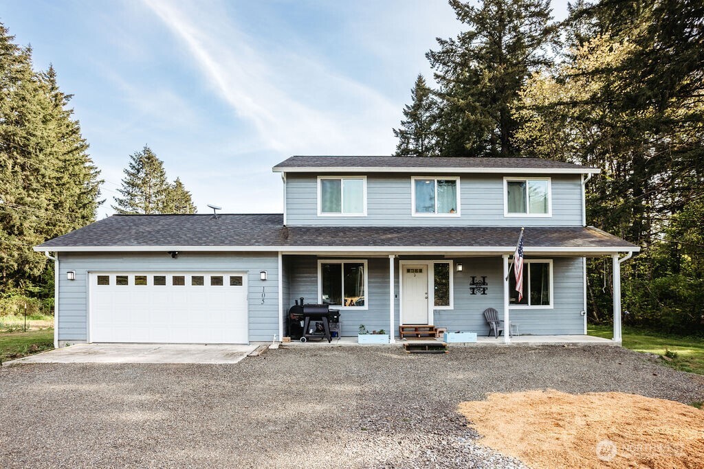 105 Johnson Road South Winlock, WA 98596 - Photo 2 of 32 a front view of a house with a yard and garage