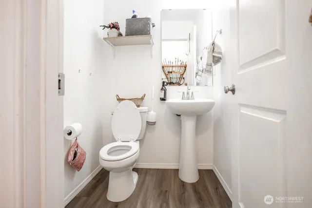 a view of a livingroom with workspace and a window