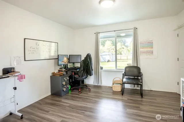 a bedroom with furniture and a window