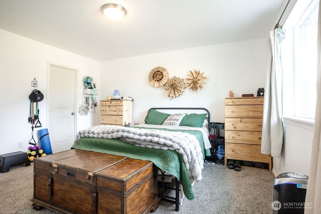 105 Johnson Road South Winlock, WA 98596 - Photo 26 of 32 a bedroom with a bed and a window