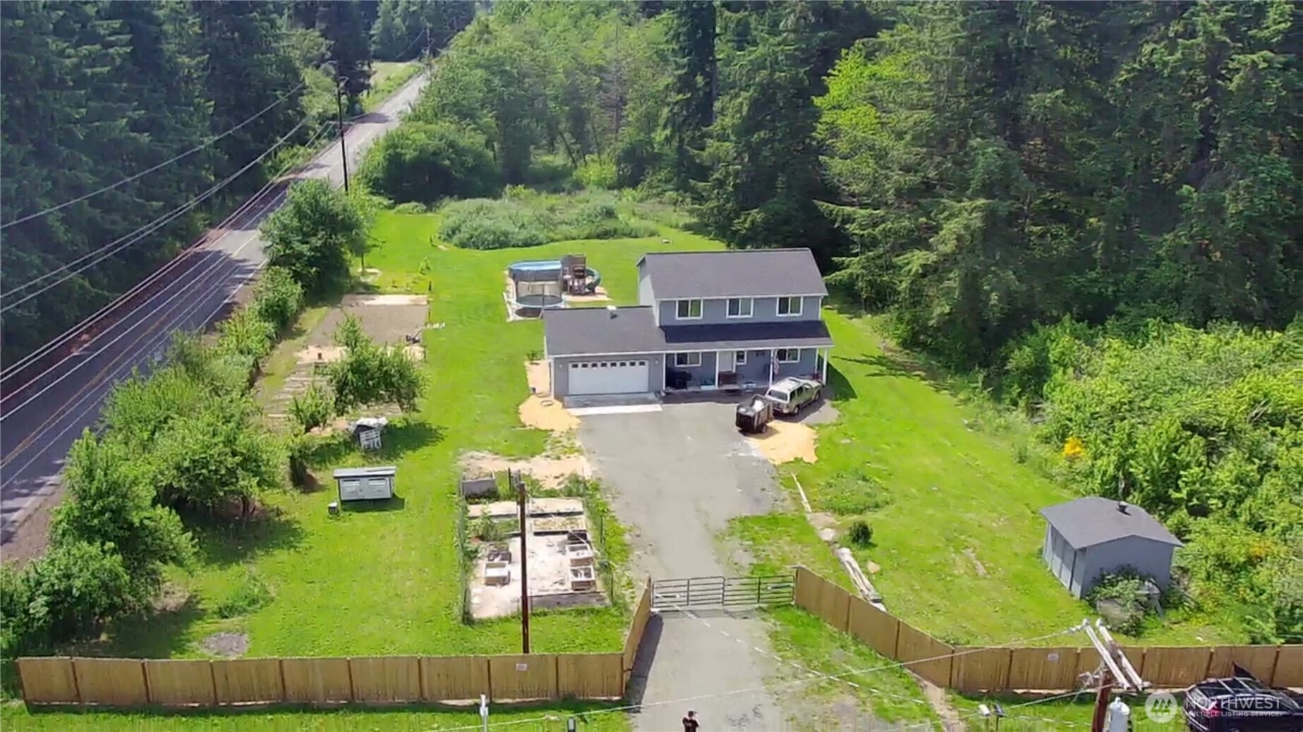 105 Johnson Road South Winlock, WA 98596 - Photo 3 of 32 an aerial view of a house with a garden