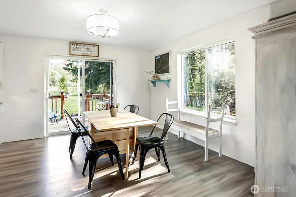 105 Johnson Road South Winlock, WA 98596 - Photo 10 of 32 a view of a dining room with furniture window and wooden floor