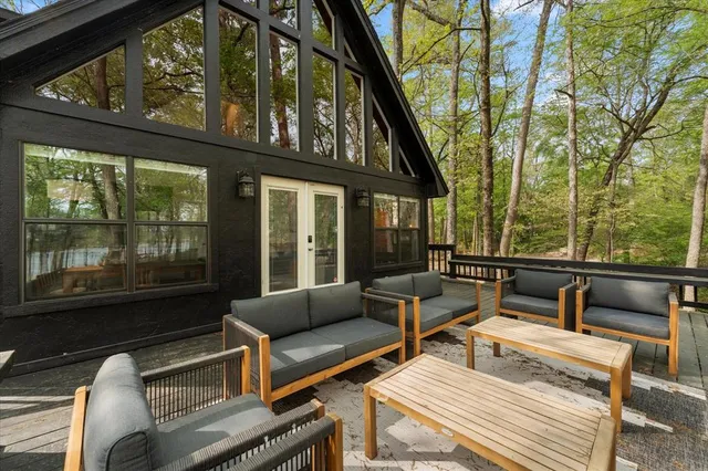 a view of a wooden deck front of house