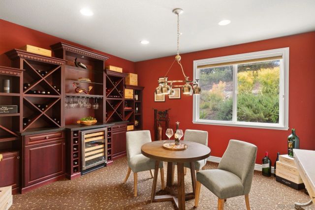 a view of a chair and table on the deck
